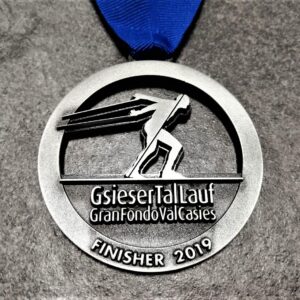 customised Gsiesertal Lauf Gran Fondo Val Casies 2019 medal in 2D metal with antique silver finish and personalised silkscreen printed ribbon.