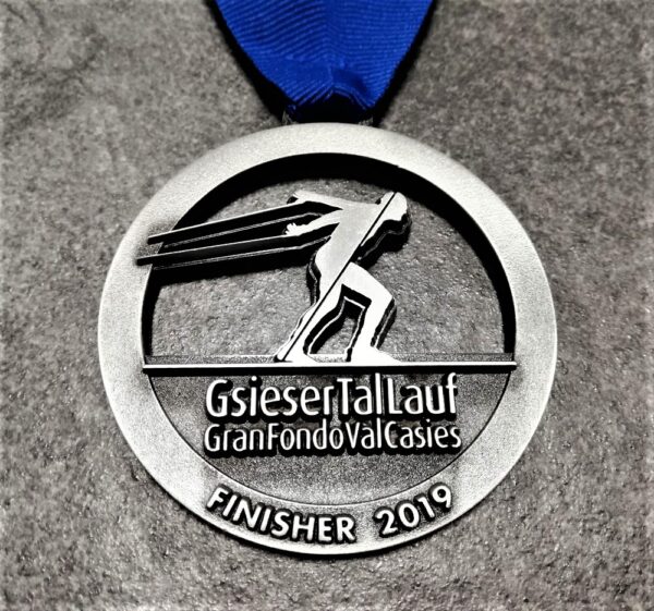 customised Gsiesertal Lauf Gran Fondo Val Casies 2019 medal in 2D metal with antique silver finish and personalised silkscreen printed ribbon.