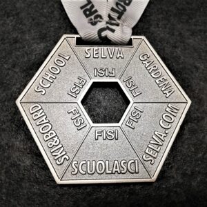customised selva Ski School hexagonal metal medal in relief 2D perforated polished silver finish with customised silk-screen printed ribbon