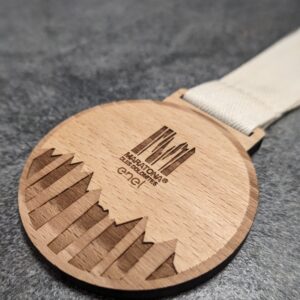 custom dles dolomites marathon medal made of laser-cut and engraved natural wood with recycled cotton ribbon