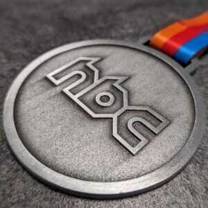 custom hbc embossed metal 2D medal without enamel antique silver finish with personalized sublimation ribbon side view