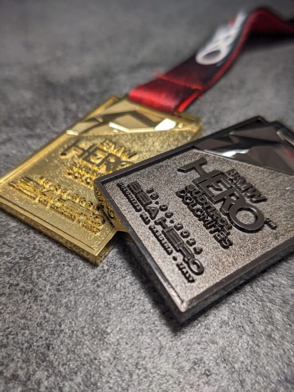 custom hero metal 3D relief medal without enamel gold and black nickel finish with satin background and polished embossing with personalized sublimation ribbon
