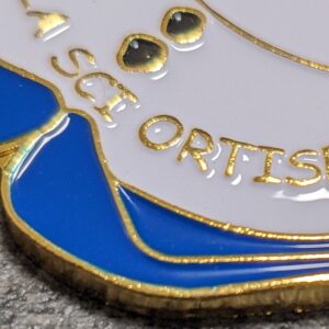 custom ortisei ski school medal in 2D embossed metal with gold finish enamel with personalized sublimation ribbon detail view