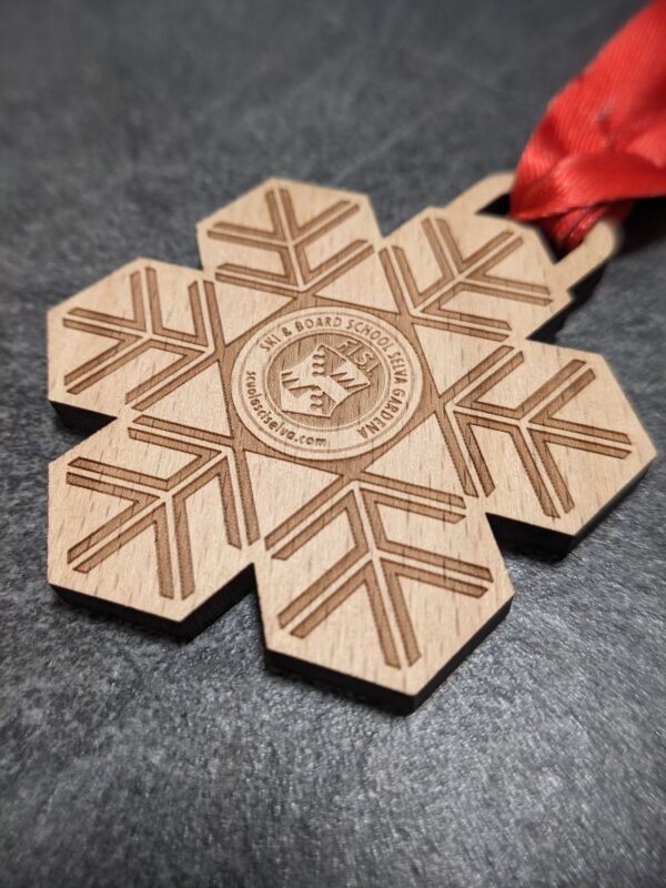 custom ski school selva medal made of natural laser cut and engraved wood with personalized sublimation ribbon side view