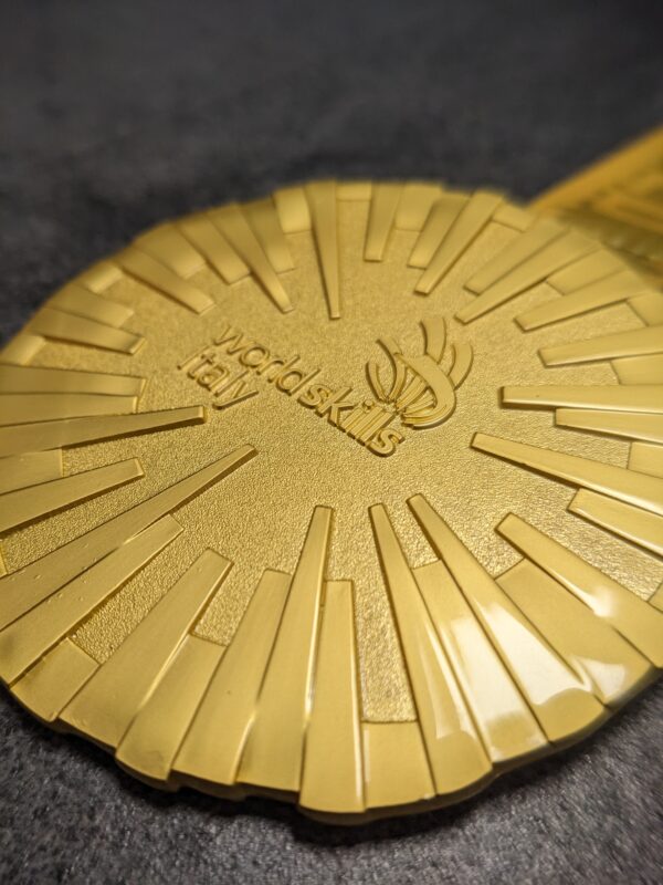 worldskills custom metal embossed 2D gold satin finish medal with personalized sublimation ribbon side view